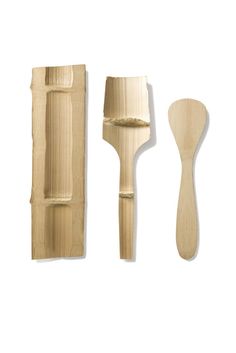 a wooden spoon, spatula and knife rest on a white background with clippings