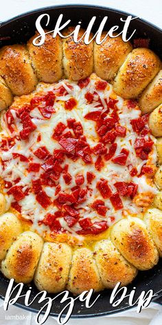 a skillet filled with bread and cheese covered in pepperoni on top of a white table