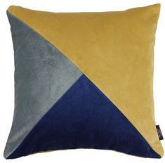 a yellow, blue and grey pillow on a white background