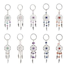 a set of nine key chains with different colored beads and charms hanging from each one