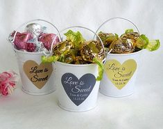 three small buckets filled with chocolate hearts