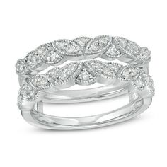 two white gold rings with diamonds on each band