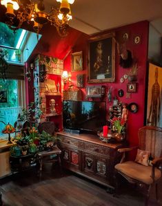 a living room filled with furniture and lots of pictures hanging on the wall above it