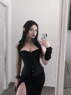 a woman in a corset taking a selfie