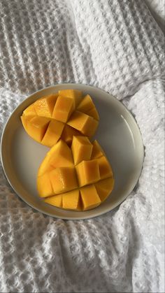 pieces of mango on a white plate