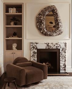 a living room filled with furniture and a fire place in front of a wall mounted mirror