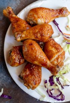 chicken wings on a plate with coleslaw