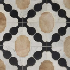 a black and white tile with circles on it