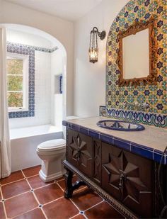 a bathroom with a sink, toilet and bathtub