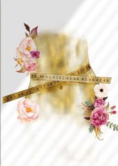 a gold ribbon with pink flowers and measuring tape