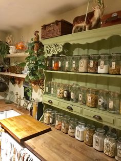 the shelves are filled with jars and spices