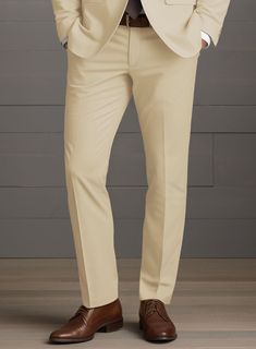 The ultimate comfortable outfit choice a man could ever have are our stretch pants which also keeps your sense of style in the forefront at your next evening do. Crafted from cotton lycra blend, the Beige Feather Cotton Canvas Stretch pants preserve its allure unaltered so as one can exude stylish statement. Combine it with a matching jacket and waistcoat, a white shirt, patterned black tie and black dress shoes.  Look Includes  Beige Feather Cotton Canvas Stretch Fabric  Cross Pocket  Flat Front  Two Welted Back Pockets on Trousers   Click 'Customize Now' to modify the look if needed.   Lining: Viscose; Dry Clean. Semi-formal Stretch Pants With Pockets, Fitted Full-length Chinos With Pockets, Beige Full-length Elastane Bottoms, Semi-formal Stretch Elastane Bottoms, Stretch Elastane Pants For Semi-formal Occasions, Slim Fit Full Length Elastane Pants, Fitted Cotton Chinos For Semi-formal Occasions, Stretch Ankle-length Dress Pants For Semi-formal Occasions, Slim Fit Full Length Solid Pants