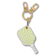 a yellow and white checkered tennis racquet keychain on a gold chain