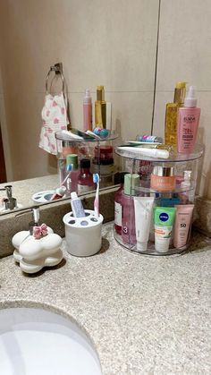 the bathroom counter has many different items on it