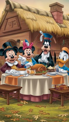 three mickey mouses are sitting at a table with food in front of an old - fashioned house