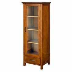 a tall wooden cabinet with glass doors and shelves on the bottom shelf is shown against a white background