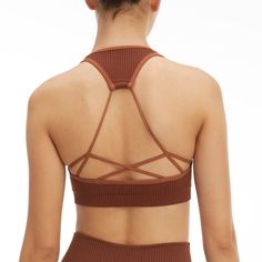 New Year, New You. Meet The Seamless Strappy Back Rib Bra. Innovative Workout Fabrication For The Smoothest Shape And Fit Yet. Pair It With The Seamless Ribbed Legging For The Full Look. Square Neckline Strap Back Ribbed Textured Seamless Construction Medium Support Padded Brown Color 93% Nylon 7% Elastane Care: Machine Wash Cold Gentle Cycle. Tumble Dry Low S/M Order Size 1/2 Brown Stretch Crop Top With Built-in Bra, Fitted Seamless Brown Sports Bra, Fitted Brown Seamless Sports Bra, Brown Seamless Activewear, Strappy Seamless Yoga Crop Top, Seamless Strappy Yoga Crop Top, Brown Seamless Stretch Activewear, Brown Stretch Seamless Tank Top, Strappy Stretch Seamless Crop Top