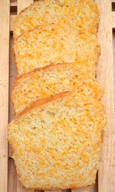 two slices of bread sitting on top of a wooden cutting board