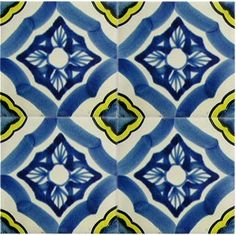 a blue and yellow tile with an intricate design