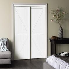 a living room with a couch and two sliding doors