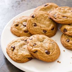 a plate full of chocolate chip cookies on a table