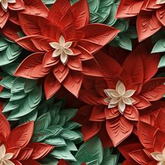 the paper flowers are red, green and white with leaves on them that resemble poinsettis