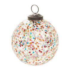 a glass ornament with multicolored dots on it