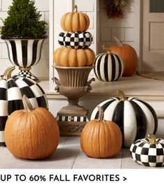 pumpkins and gourds are on display in front of a door with the words up to 60 % fall favorites