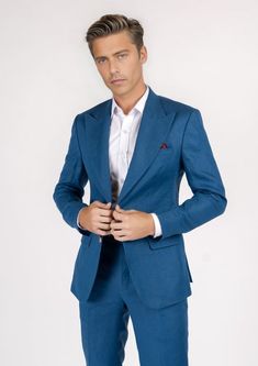 The Hudson Marine Blue Linen Suit is the perfect expression of summer luxury. Crafted from 100% linen in a vibrant marine blue hue, this custom suit will make an elegant statement wherever you wear it. Perfect for hot summer days, its lightweight fabric will keep you looking sharp while feeling cool and comfortable. Blue Linen Business Blazer, Blue Linen Blazer For Business, Blue Linen Blazer For Workwear, Blue Linen Blazer For Semi-formal Occasions, Blue Linen Single Breasted Suit, Blue Single-breasted Linen Suit, Fitted Blue Linen Blazer, Blue Linen Single-breasted Suit, Luxury Summer Blazer