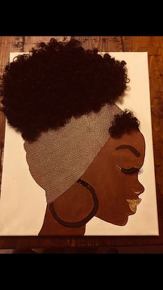 a painting of a woman's head with an afro on it