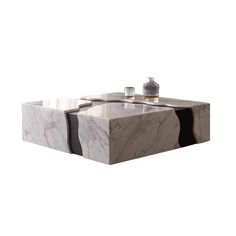 a marble coffee table with two candles on the top and one candle holder in the middle