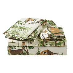 three sheets with animals on them and trees in the background, one is folded up