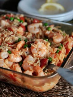 an image of shrimp and rice in a glass casserole dish on instagram