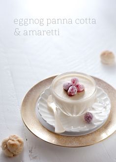 a white plate topped with a cup and saucer covered in sugared candies