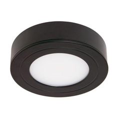 a black circular light fixture on a white background