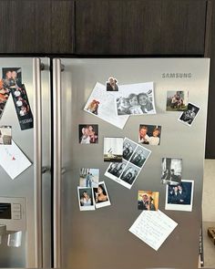 a stainless steel refrigerator with pictures and magnets on it