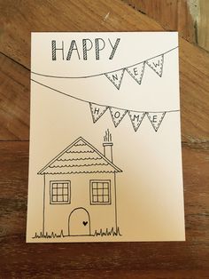 a card with a drawing of a house and bunting flags on it that says happy home