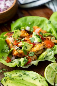 lettuce wraps filled with chicken, tomatoes and avocado