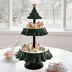 three tiered christmas tree cake stand with cupcakes