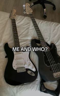 two guitars are laying on a bed with the caption me and who?