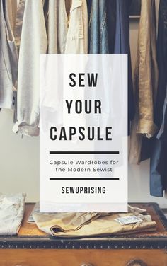 an open suitcase sitting on top of a wooden table with clothes hanging from it and the words sew your capsule