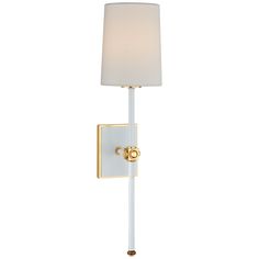 a white and gold wall light with a lamp shade on the side, against a white background