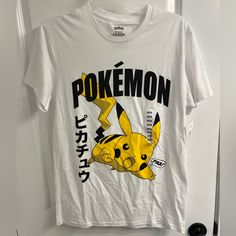 a white t - shirt with the words pokemon printed on it