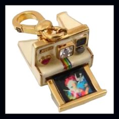 Juicy Couture 2009 Vintage Camera Charm New Without Tags This Is Such A Detailed Little Charm. It’s Absolutely Stunning! There Is A Red Heart On The Front For The Flash Beautiful Crystal For The Lens Tray Pulls Out To Reveal An Actual Polaroid Photo Retired & Authentic Gold Lobster Clasp With Juicy Crown Logo Says “Juicy” On The Front In Gold Juicy Crest Logo On The Bottom Authentic & Retired Check Out My Other Vintage Juicy Couture Charms, Retro Juicy, Pave, Rhinestones, Limited Edition, Excell Juicy Charms, Camera Charm, Polaroid Camera, More Than, Juicy Couture Charms, Vintage Camera, Cute Charms, Pandora Jewelry, Bracelets And Charms