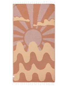 an orange and pink rug with the sun in the sky on top of it,