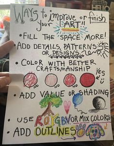 a child's hand holding up a sign that says, ways to improve art fill the space more