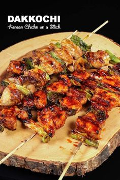 chicken and broccoli skewers on a wooden board