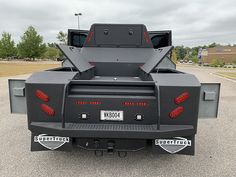 the back end of a truck parked in a parking lot