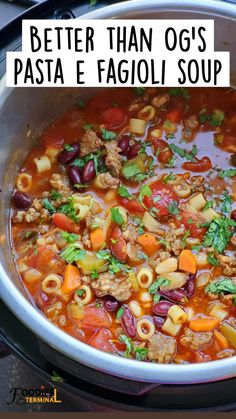 a large pot filled with pasta and meat soup next to the words, better than og's pasta e fagioi soup