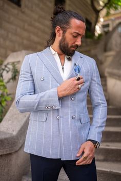 Make a statement with the HolloMen Piazza Double-Breasted Blue Jacket. This stylish jacket is crafted with premium materials and features a classic double-breasted design, perfect for the modern gentleman who appreciates timeless fashion.